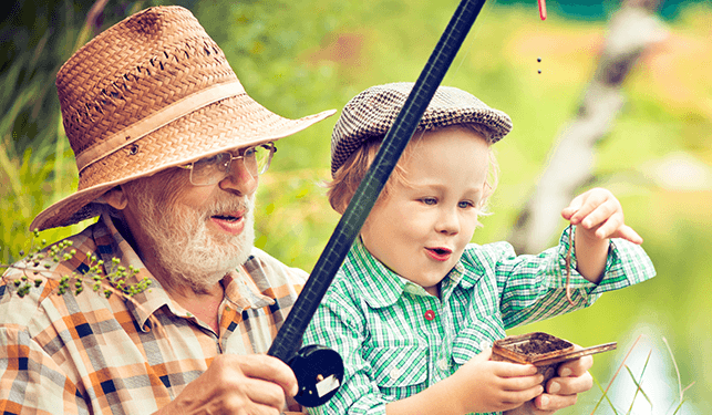 Grandpa is fishing with little grandson
