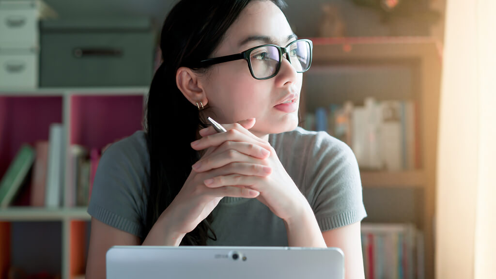 Female wearing glasses looking away on her right